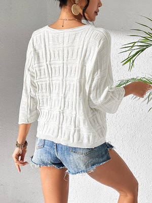 White textured knit dolman sleeve sweater with 3/4 sleeves and a relaxed fit.