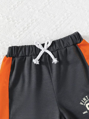 Color block baby set with drawstring waist and orange side stripe detail.