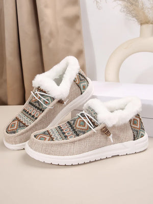 Southwestern print faux fur lined loafers in taupe with white laces.