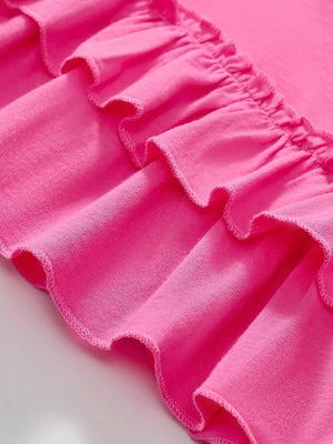 Pink toddler dress with double-layered ruffled hem detail, cotton fabric.