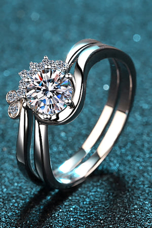 Celestial Moissanite Duo Ring Set in silver with a large round center stone and smaller accent stones.