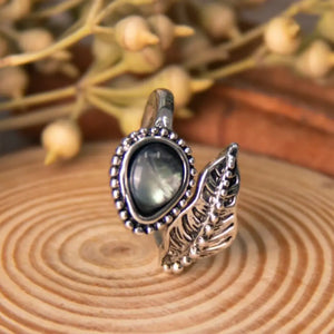 Silver bypass ring with pearly teardrop stone and leaf detail
