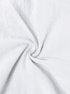 White cargo sweatpants with drawstring detail, showing textured fabric.