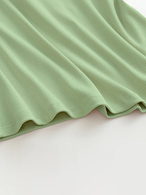 Ribbed halter tank top in Gum Leaf green with built-in bra detail.