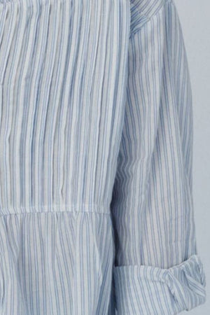 Light blue and white striped peplum blouse with pleats and cinched waist detail.