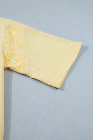 Yellow cotton half-sleeve top with eyelet lace detail on the sleeve.