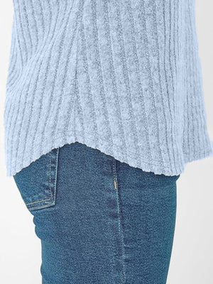 Light blue ribbed V-neck t-shirt with a relaxed fit, shown with jeans.