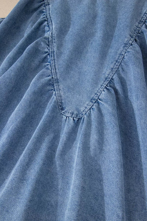 V-shaped pleated denim sleeveless top with a V-neckline detail