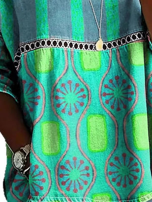 Bohemian maternity t-shirt in blue with floral and geometric print, openwork trim detail.