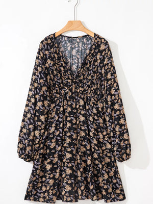 Floral babydoll dress with deep V-neck, bubble sleeves, and dark floral pattern.