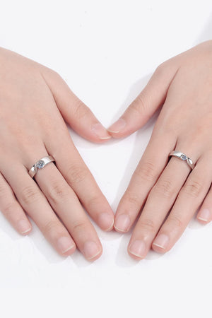 Curved Embrace diamond ring set for men and women, silver band with a single sparkling stone.
