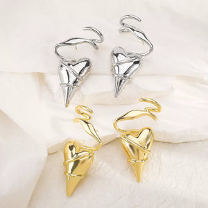 Twisted heart wire earrings in silver and gold luxe finish with unique spiral detail.
