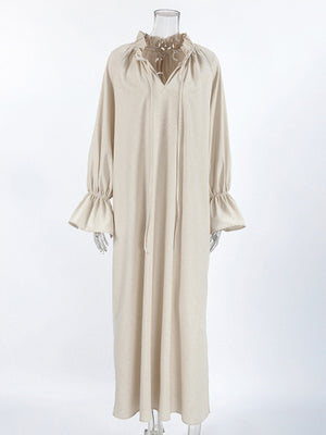 Beige cotton maxi dress with tie neck and ruffled cuffs