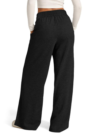 Black seamed palazzo lounge trousers with elastic waistband and pockets.