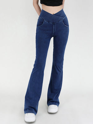 Medium wash denim flare jeans with a crossover waistband.