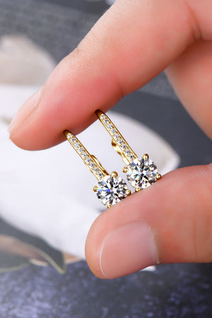 Gold leverback earrings with pavé-set moissanite and round-cut center stones.