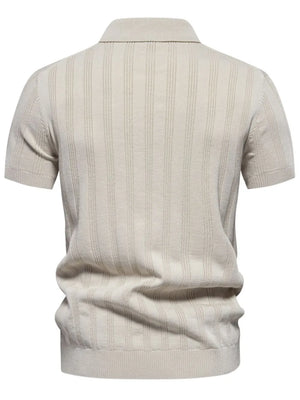 Beige ribbed knit polo shirt with vertical texture detail and short sleeves.