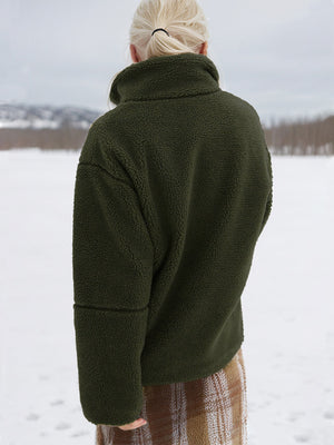 Olive green sherpa stand-collar jacket with textured fleece and seam detail on sleeves.