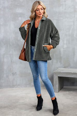 Textured teddy jacket in charcoal with corduroy trim and button closure.