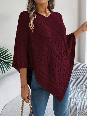 Burgundy cable knit poncho with chevron detail and V-neck.
