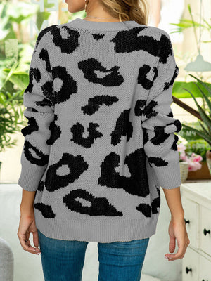 Grey leopard intarsia crewneck sweater with long sleeves and ribbed cuffs.