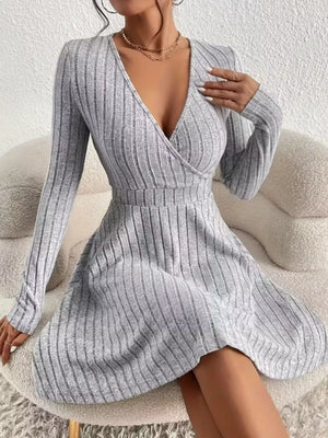 Light gray ribbed wrap mini dress with long sleeves and a V-neck.