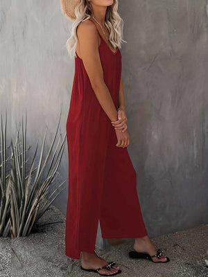 Burgundy gathered bodice wide-leg jumpsuit with spaghetti straps and a V-neckline.