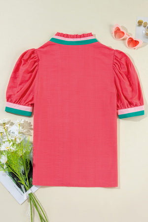 Colorblock puff sleeve blouse in strawberry pink with green and pink collar and cuffs.