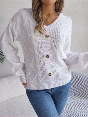 White cable knit button-front cardigan with V-neck and acrylic material.