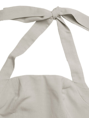 Halter neck maxi dress in beige with tie detail.