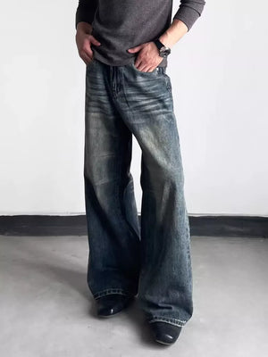 Men's blue distressed wide-leg denim jeans with a relaxed fit.