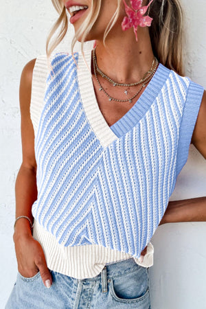 Chevron knit vest in light blue and cream with a V-neck and open knit pattern.