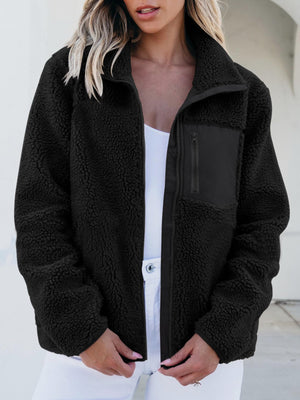 Black sherpa zip-up jacket with a zippered chest pocket and stand-up collar.