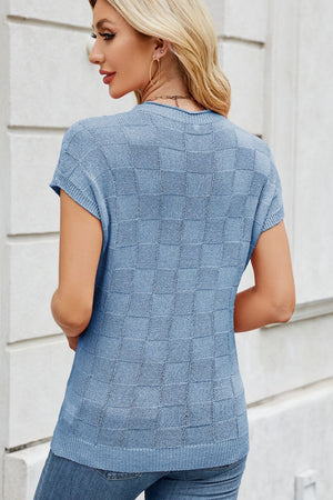 Sky blue knit top with short sleeves and a checkered texture.