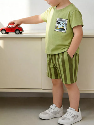 Boys' light green cotton t-shirt with paradise graphic and green striped shorts.