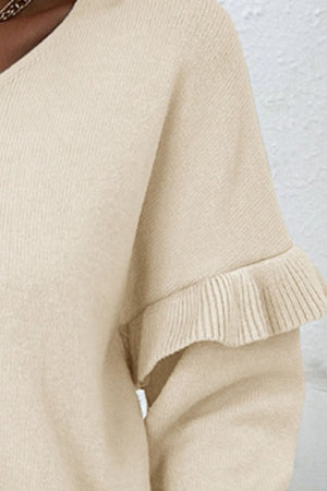 Light yellow knit v-neck pullover sweater with ruffled sleeves.