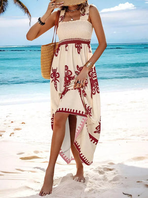 Cream maxi dress with smocked bodice, square neck, and red floral print.