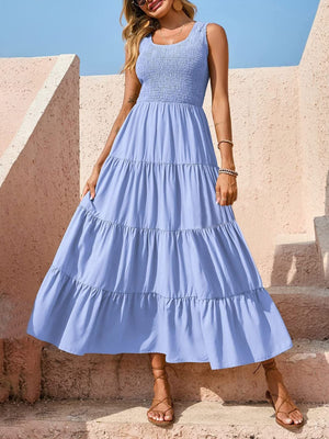 Light blue smocked bodice ruffled maxi dress with tiered skirt and square neckline.