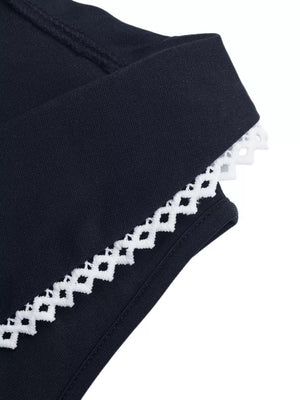 Black vest with white lace trim detail