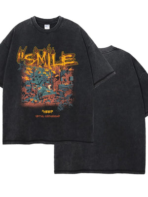 Black washed oversized graphic t-shirt with "SMILE" text and a scene graphic.
