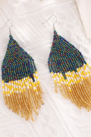 Geometric fringe beaded earrings with multicolor, yellow, white, and gold beads.