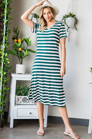 Striped jersey maxi dress with v-neck, short sleeves, and slit hem in green and white stripes.