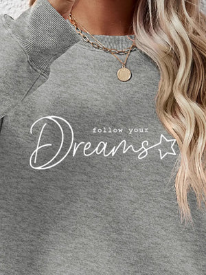 Dreams Scripted Oversized Sweatshirt in Charcoal with white text detail.