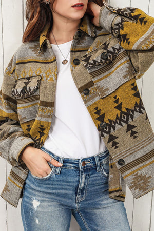 GeoChic collar jacket in camel with geometric pattern and chest pockets.