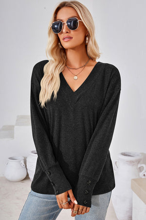 Black V-neck long sleeve top with button cuffs