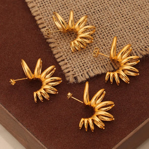 Gold sculptural petal drop earrings with unique spiral detail