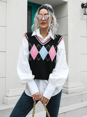 Argyle knit sweater vest with pink and blue diamonds, V-neck, trimmed with pink and white.