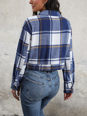 Checked plaid shacket in blue and white with buttoned cuffs and collar.