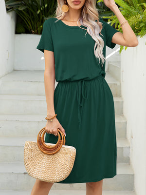 Green midi dress with drawstring waist, short sleeves, and pockets.