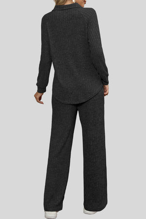 Black ribbed knit lounge set with collar and wide leg pants.